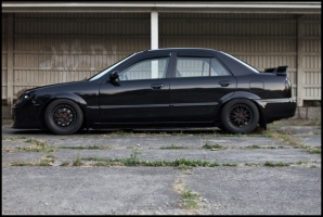 2003 Mazda Protege with 16x8 XXR 521 wheels