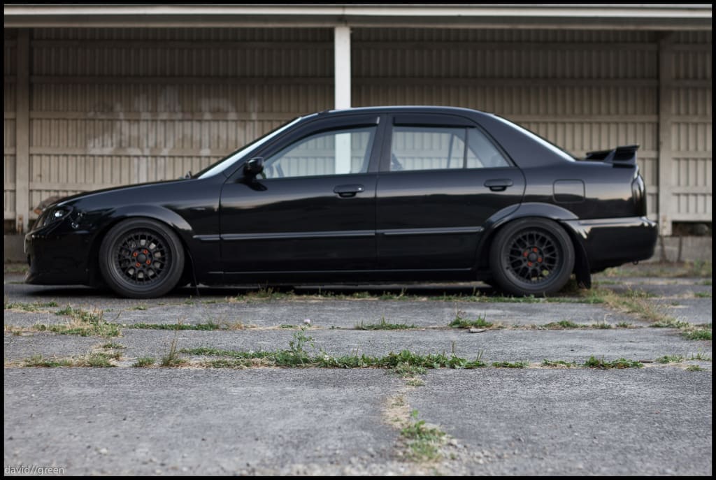 2003 Mazda Protege with 16x8 XXR 521 wheels