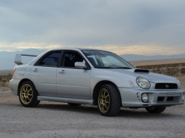 2001 Subaru Impreza with 17x8.5 Rota Revs wheels