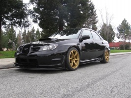 2007 Subaru Impreza with 18x9 Rota Boost wheels