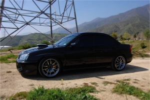 2004 Subaru Impreza with 18x9.5 Rota Torque-R wheels