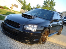 2004 Subaru Impreza with 18x8.5 Rota SVN wheels