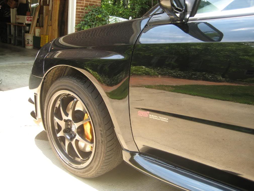 2006 Subaru Impreza with 17x8 Rota Rev wheels