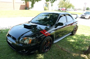 2004 Subaru Impreza with 17x8 Rota Boost wheels
