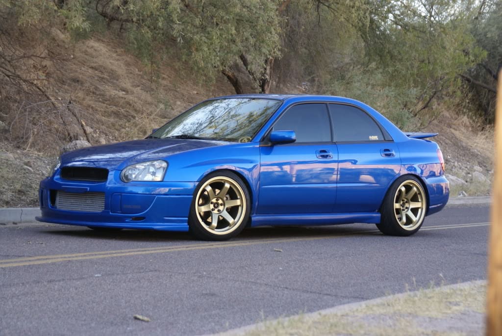 2004 Subaru Impreza with 18x9.5 Rota Grid wheels