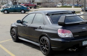 2007 Subaru Impreza with 18x8.5 Rota G-Force wheels