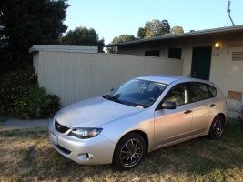 2009 Subaru Impreza with 17x8 Rota G-Force wheels