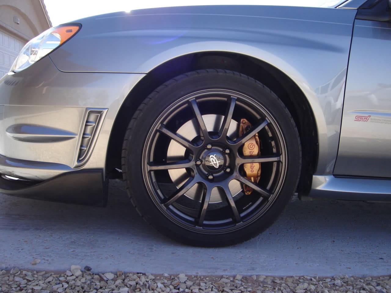 2006 Subaru Impreza with 18x8.5 Rota G-Force wheels