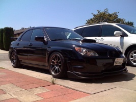 2006 Subaru Impreza with 17x9 Rota Torque R wheels