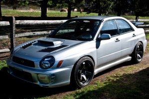2003 Subaru Impreza with 18x9.5 Rota Grid wheels
