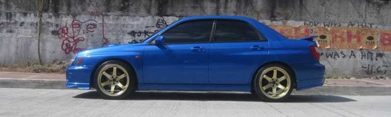 2003 Subaru Impreza with 18x9.5 Rota Grid wheels