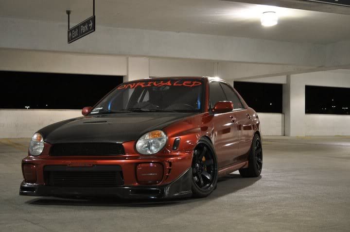2003 Subaru Impreza with 18x9.5 Rota Grid wheels