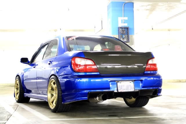 2006 Subaru Impreza with 18x9.5 Rota Grid wheels