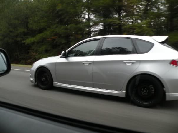 2009 Subaru Impreza with 17x8 Rota Subzero wheels