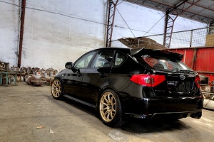 2009 Subaru Impreza with 18x9.5 Rota T2R wheels