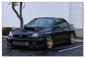 2003 Subaru Impreza with 18x8.5 Rota Grid wheels