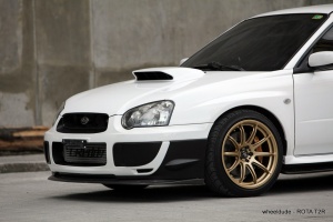 2004 Subaru Impreza with 18x9.5 Rota T2R wheels