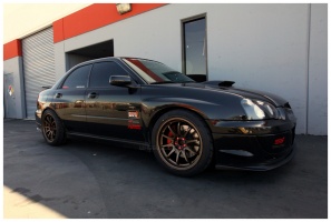2004 Subaru Impreza with 18x9.5 Rota DPT wheels