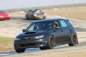 2011 Subaru Impreza with 18x9.5 Rota Grid wheels