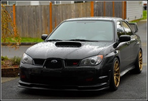 2007 Subaru Impreza with 18x9.5 Rota T2R wheels
