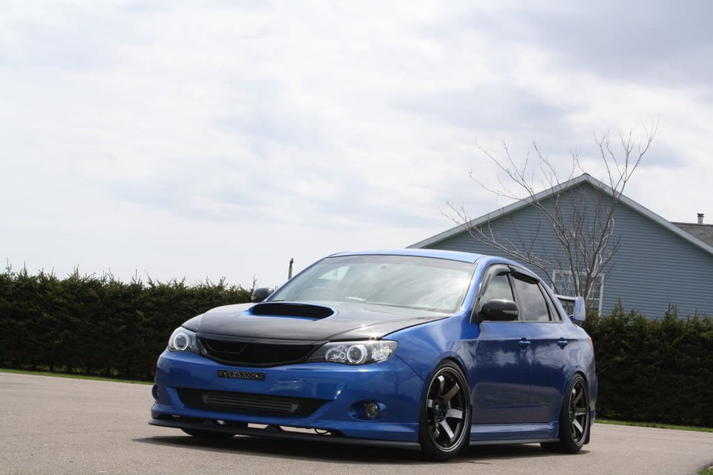 2009 Subaru Impreza with 18x9.5 Rota Grid wheels
