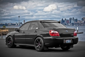 2006 Subaru Impreza with 18x9.5 Rota Grid wheels