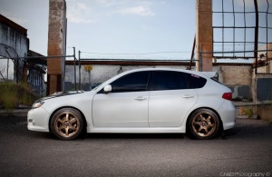 2009 Subaru Impreza with 17x7.5 Rota Grid wheels