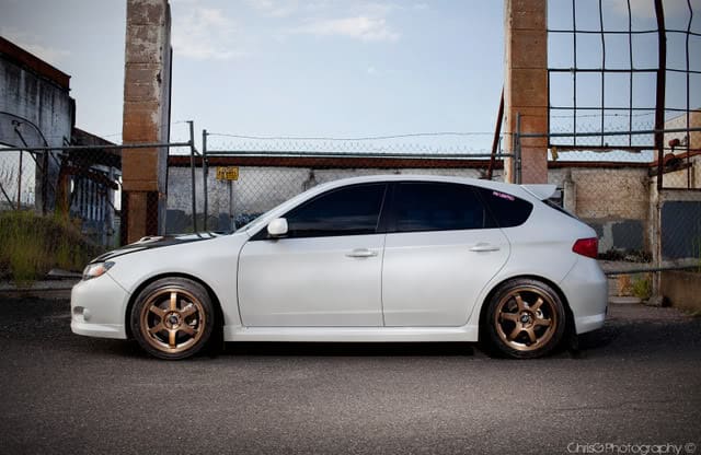2009 Subaru Impreza with 17x7.5 Rota Grid wheels