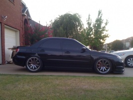 2006 Subaru Impreza with 18x9.5 Rota T2R wheels