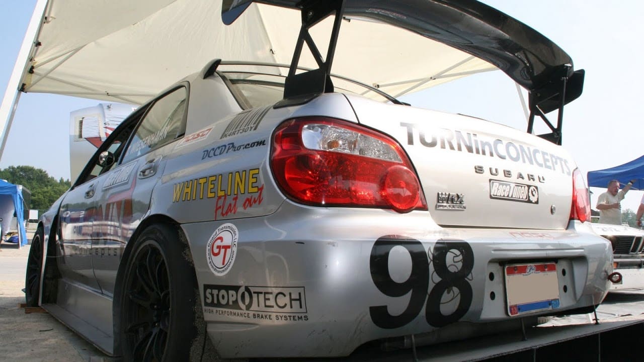 2005 Subaru Impreza with 18x10 Rota T2R wheels