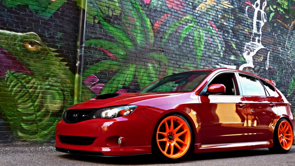 2010 Subaru Impreza with 18x9.5 Rota Torque-R wheels