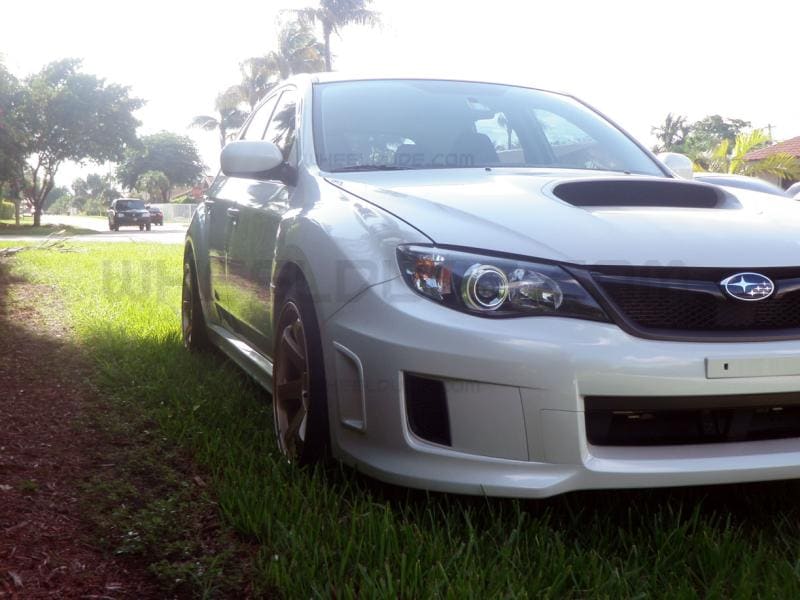 2011 Subaru Impreza WRX with 18x9.5 Rota Grid wheels