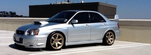 2009 Subaru Impreza with 18x9.5 Rota Grid wheels