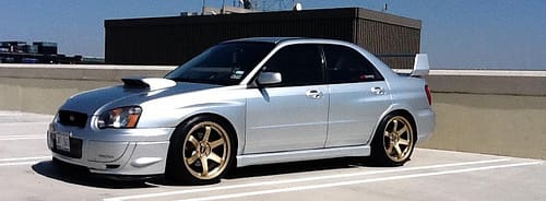 2009 Subaru Impreza with 18x9.5 Rota Grid wheels