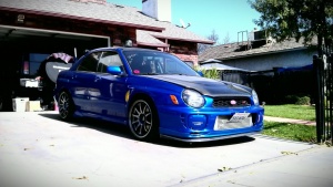 2003 Subaru Impreza with 18x9.5 Rota DPT wheels