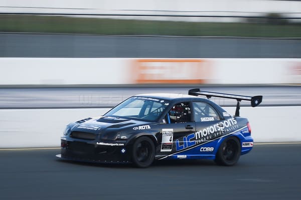 2011 Subaru Impreza WRX with 18x9.5 Rota Grid wheels