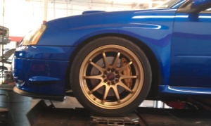 2009 Subaru Impreza with 18x9.5 Rota DPT wheels