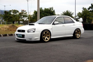 2004 Subaru Impreza with 18x9.5 Rota Grid wheels