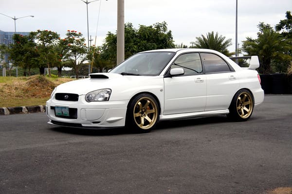2004 Subaru Impreza with 18x9.5 Rota Grid wheels