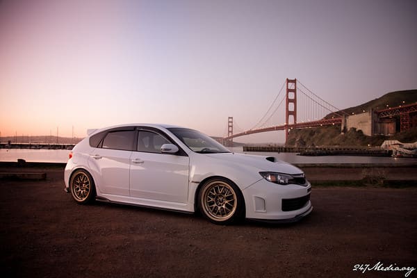 2011 Subaru Impreza WRX with 18x9.5 Rota MXR wheels