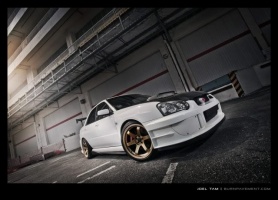 2004 Subaru Impreza with 18x9.5 Rota Grid wheels