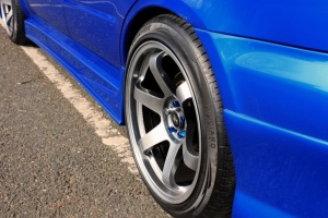 2003 Subaru Impreza with 18x9.5 Rota Grid wheels
