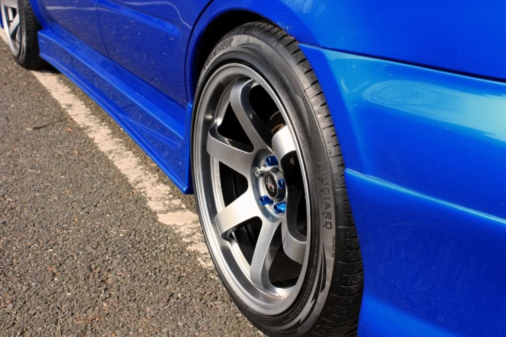 2003 Subaru Impreza with 18x9.5 Rota Grid wheels