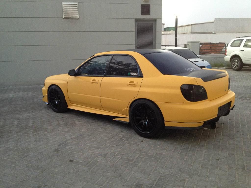 2003 Subaru Impreza with 18x9 Rota T2R wheels