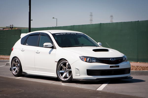 2010 Subaru Impreza with 18x9.5 Rota Grid wheels