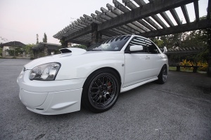 2004 Subaru Impreza with 18x9.5 Rota MXR wheels