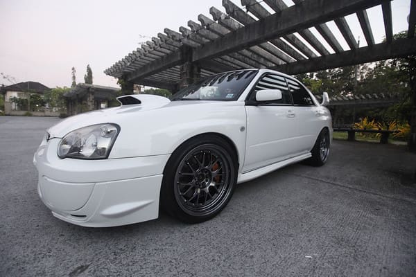 2004 Subaru Impreza with 18x9.5 Rota MXR wheels