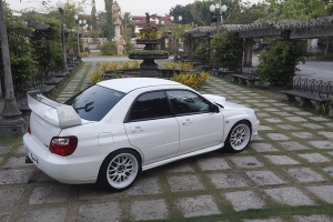 2004 Subaru Impreza with 18x9.5 Rota MXR wheels