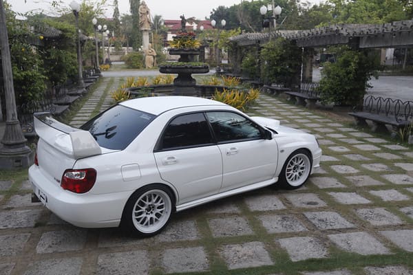 2004 Subaru Impreza with 18x9.5 Rota MXR wheels