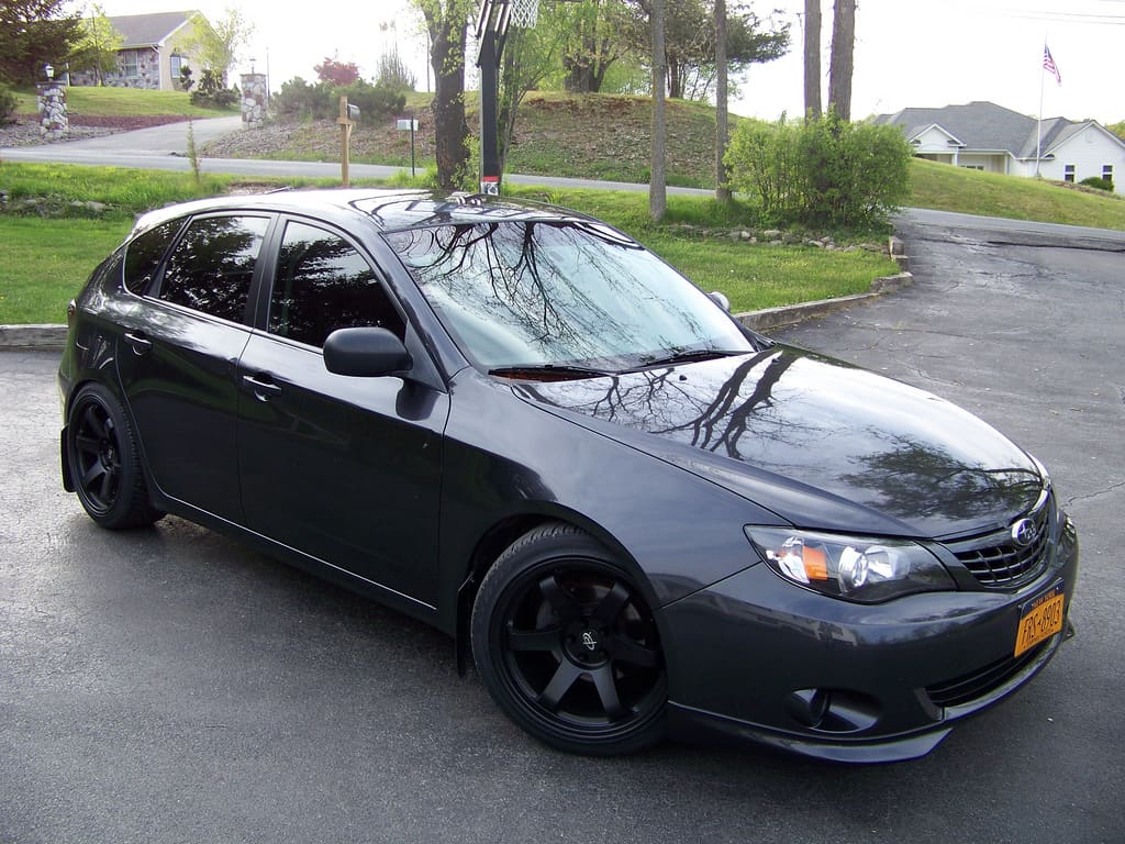 2011 Subaru Impreza with 18x9.5 Rota Grid wheels